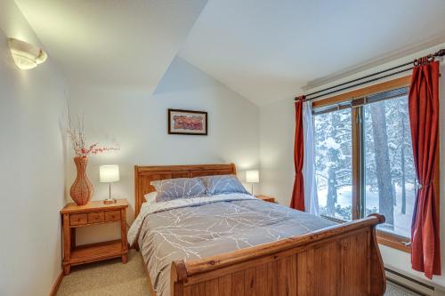 a bedroom with a wooden bed and a window at Mt Bachelor Village Resort Condo 19 Mi to Skiing! in Bend