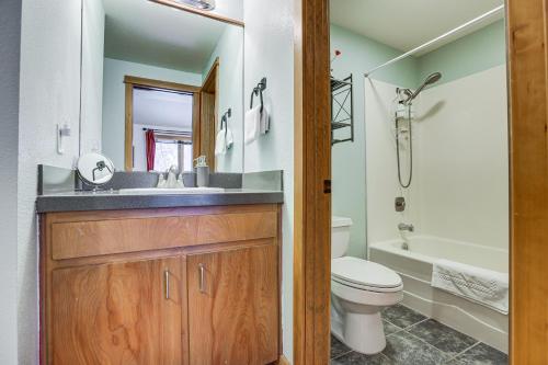 a bathroom with a sink and a toilet and a tub at Mt Bachelor Village Resort Condo 19 Mi to Skiing! in Bend