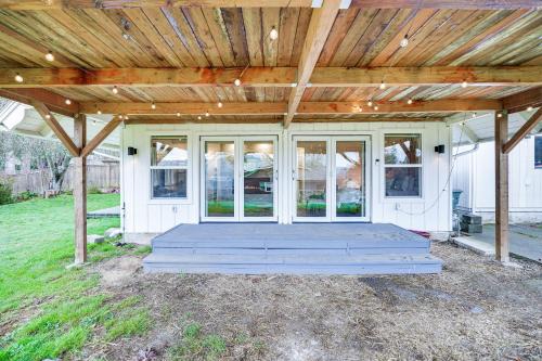 a front porch of a house with a wooden roof at Stylish Bellingham Home with Lake and Mountain Views! in Bellingham