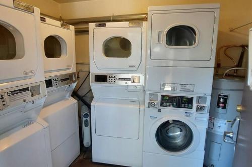 a group of washing machines and a washer and dryer at Cozy Cabin-Style Condo in Central Location in Mammoth Lakes