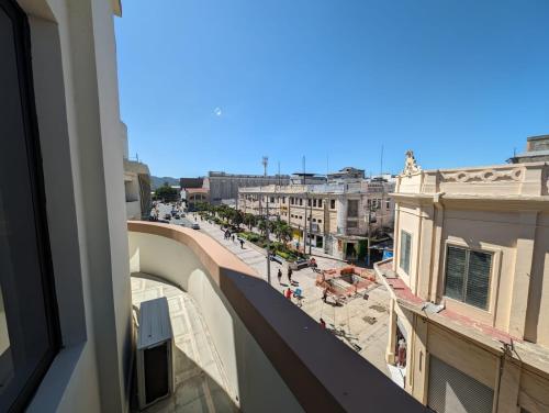 a view of a city street from a building at Hotel Abrego in San Salvador