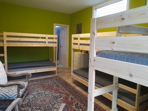 a room with four bunk beds in a room at Esztergomi Galagonyás Ház in Esztergom