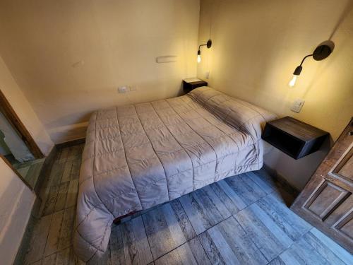 Una cama o camas en una habitación de CerroNegro