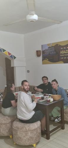 a group of people sitting at a table at ABAZIDO Nubian Guest House in Aswan