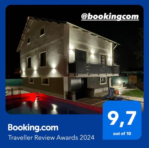 a house with a pool in front of it at night at IL Sole in Caselle Torinese
