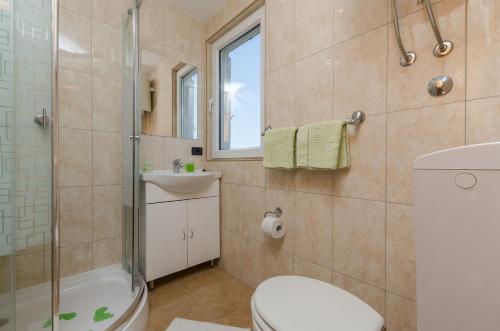 Kúpeľňa v ubytovaní Apartments Sinisa