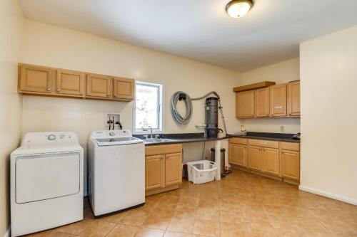 a kitchen with a dishwasher and a washer at Deck and Lake View Spacious Long Pond Home! in Long Pond