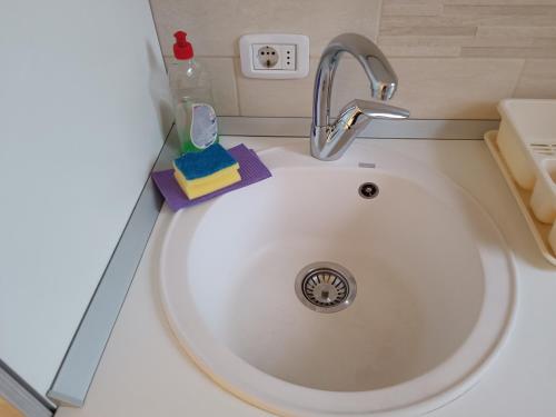 a sink with a faucet in a bathroom at Apartmani Janjic in Banja Luka