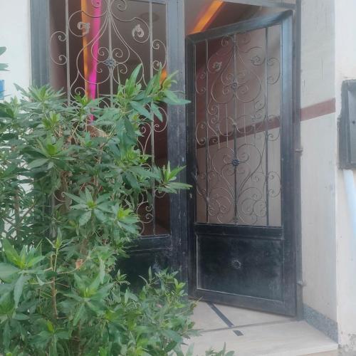 an open door to a building with plants at Hurghada Sea View Apartment in Hurghada