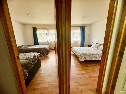 Una cama o camas en una habitación de Cabañas Antü 2