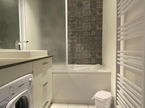 a bathroom with a sink and a washing machine at Appartement Valloire, 2 pièces, 4 personnes - FR-1-263-421 in Valloire