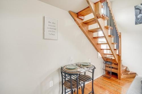 a small table in a room with a staircase at PachecoandMartinez Studio 22 Mi to Dtwn Oakland! in Pacheco