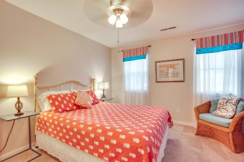 a bedroom with a bed and a chair and windows at Beaufort Home with Patio 3 Mi to Downtown! in Beaufort