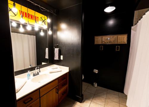 a bathroom with a sink and a mirror at The C-Street Archive in Springfield