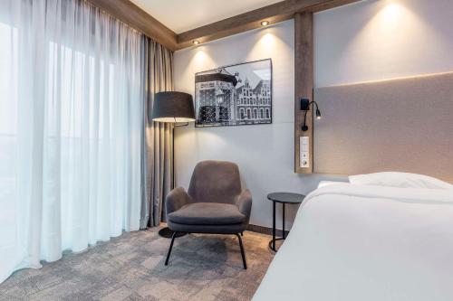Ένα ή περισσότερα κρεβάτια σε δωμάτιο στο Park Inn By Radisson Wismar