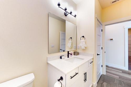 a bathroom with a sink and a mirror at Lakeview Retreat in Manson