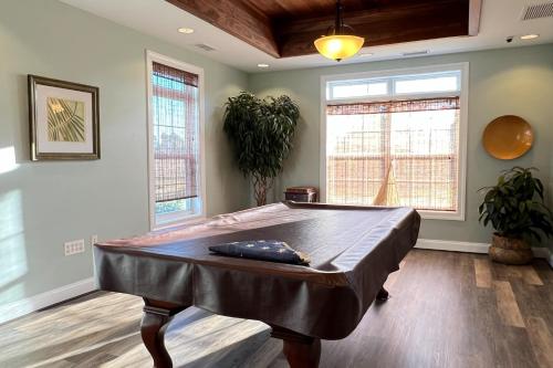 a large room with a pool table in it at White Creek at Bethany --- 30930 Sea Breeze Ln in Ocean View