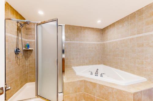 a bathroom with a bath tub and a sink at Bahia Vista II 304 in Ocean City