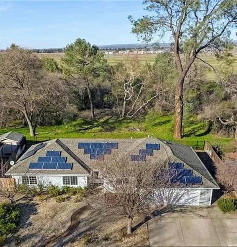 an overhead view of a house with solar panels on the roof at Chico Creek House - Hot Tub, Game Room & Fire Pit in Chico