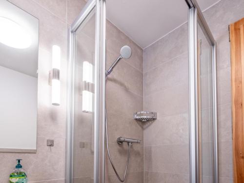 a shower with a glass door in a bathroom at Selbhorn in Hinterthal