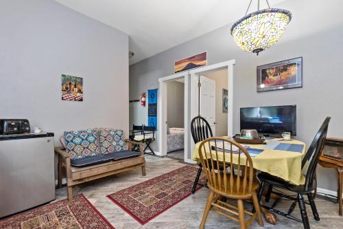 a kitchen and dining room with a table and chairs at Mountain Meadows Inn & Chalet Suites in Ashford