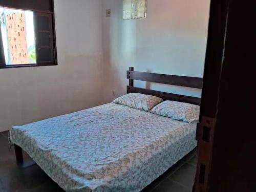Ένα ή περισσότερα κρεβάτια σε δωμάτιο στο Apartamento em Ilhéus