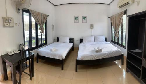 Łóżko lub łóżka w pokoju w obiekcie Diamond Villa Vang Vieng