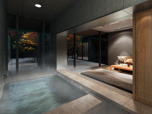 a pool in the middle of a house at Mitsui Garden Hotel Kyoto Sanjo PREMIER in Kyoto