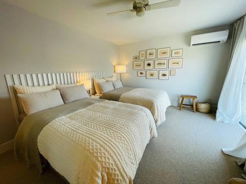 a bedroom with two beds and a window at THON国分町 in Higashi-kotohiramachi