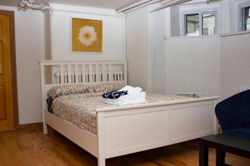 a bedroom with a white bed and a window at Studio & Office -Walk anywhere Downtown + Hospital in Montréal