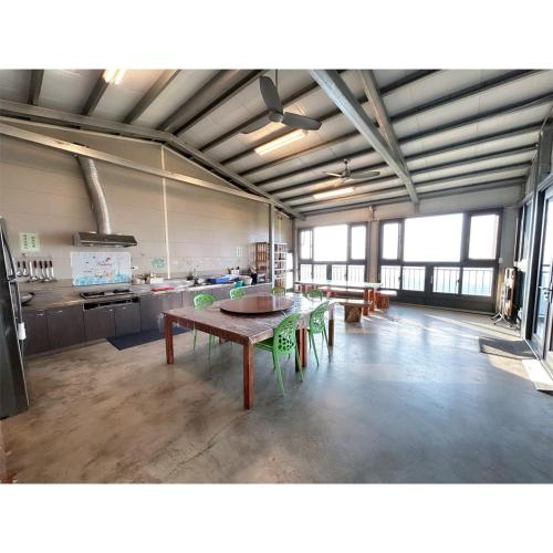 a large room with a table and a kitchen at 星森林包棟住宿-台中東勢-山區景觀 in Dongshi