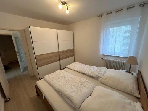 Postel nebo postele na pokoji v ubytování Küstenbude am Dünenpark