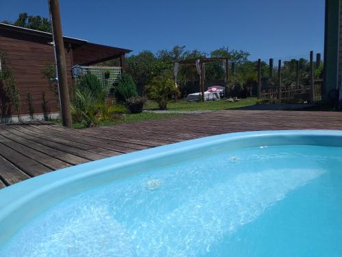 a close up of a swimming pool in a yard at pimenta rosa guesthouse in Praia do Rosa