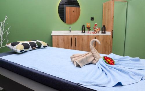a bedroom with a large bed with a sink at MİLLS HOTEL in Tekirdag