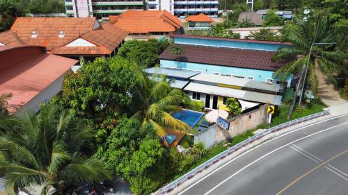 an overhead view of a building with a swimming pool at At Thara Aonang in Ao Nang Beach