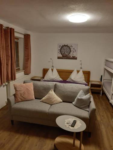 a living room with a couch and a table at Apartment Rahm in Gerlosberg