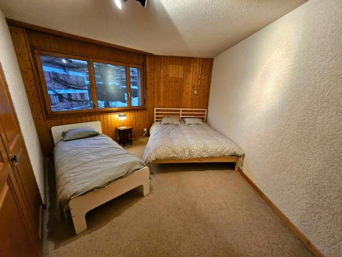 Postel nebo postele na pokoji v ubytování Verbier Appartement Andrea