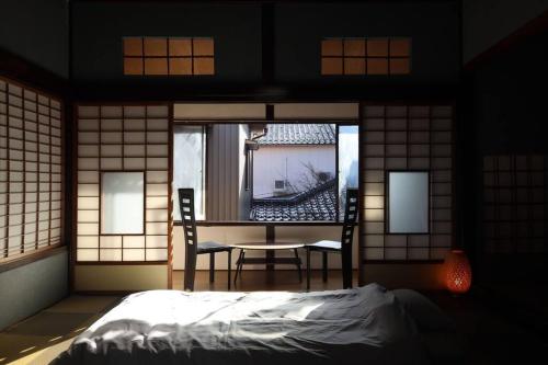 Cama o camas de una habitación en くつろぎのお宿「やわや」
