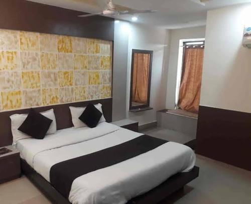 Hotel Goa Heritage Resort tesisinde bir odada yatak veya yataklar