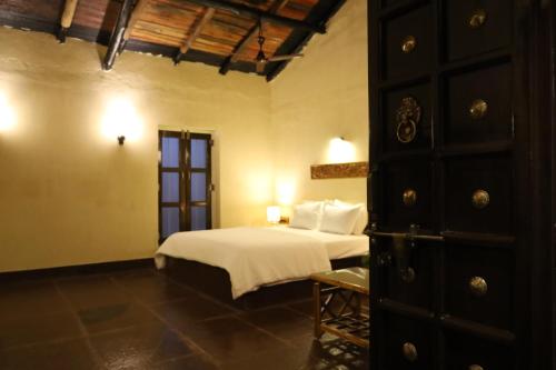 A bed or beds in a room at Bastar Greens