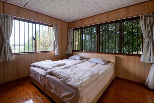 Ένα ή περισσότερα κρεβάτια σε δωμάτιο στο Bisenoyado Onn -SEVEN Hotels and Resorts-