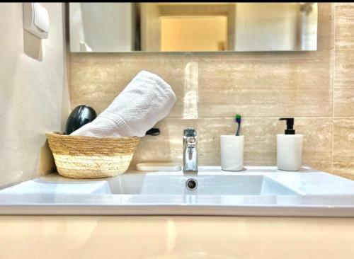 a bathroom sink with a roll of paper towels at Prestigia,Golf, piscine, soleil, paysage, sport, spacieux,lux résidence in Marrakesh