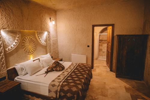 Letto o letti in una camera di Çavuşin Cave House-Cappadocia