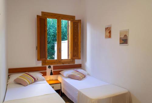 En eller flere senge i et værelse på Residence Tre Palme - Localo