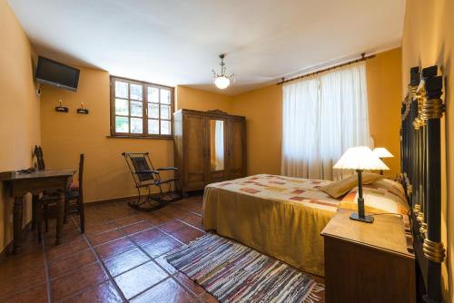 Ένα ή περισσότερα κρεβάτια σε δωμάτιο στο Hotel Rural Valle de Ancares