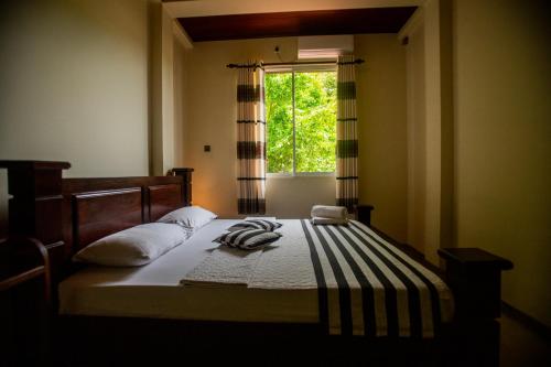 Postel nebo postele na pokoji v ubytování Evergreen Hotel Dambulla