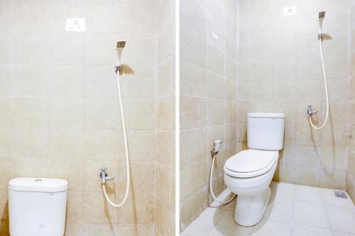 a bathroom with a toilet and a shower at OYO Life 90388 De'leota in Semarang