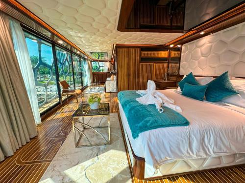 a bedroom with a bed with towels on it at Overnight Super Yacht - Orchid in Dubai