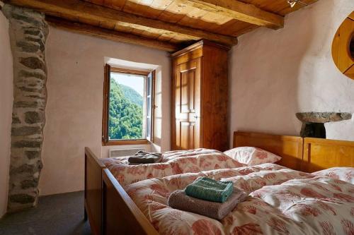Postel nebo postele na pokoji v ubytování Wild Valley Puro Ticino 1 in Valle Onsernone