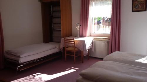 Cama ou camas em um quarto em Albergo Alpino